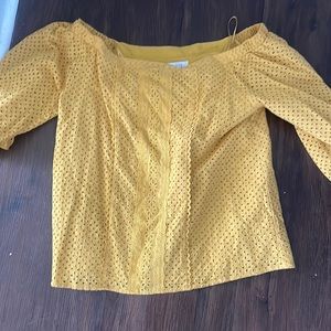 Clary’s Mustard colored top. So M. Ret $82